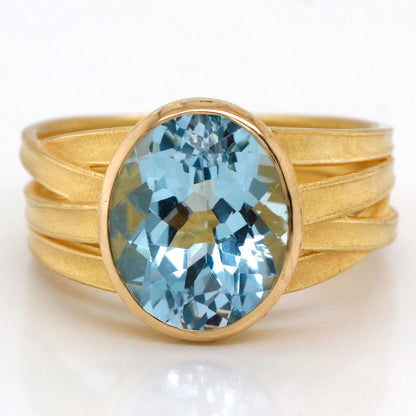 Large Oval Blue Topaz Ribbon Ring