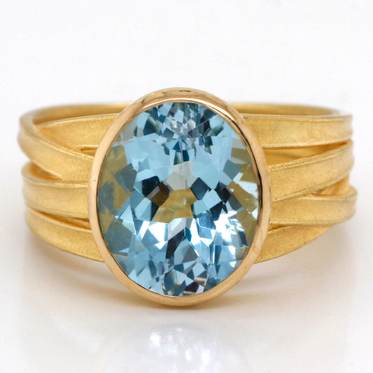 Large Oval Blue Topaz Ribbon Ring